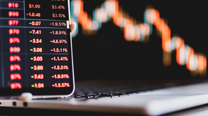 Stock Market Dynamics: A smartphone displays real-time stock market data with a blurred, dynamic stock chart in the background, symbolizing the ever-changing financial landscape.