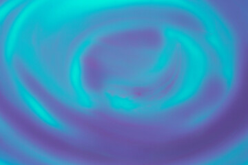 swirl of blue and turquoise color liquid watercolor paints background