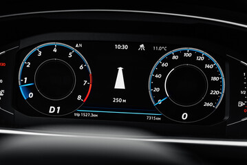 Car digital dashboard with big navigation arrow in the middle. White arrow on black background in...
