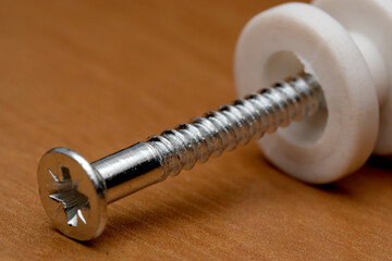 Screw and spacer on wood highlight details