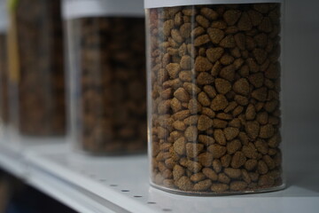 Pellets of dry food in containers. Food for pets.