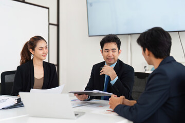 Professional Consultation and Engagement. Participants sharing insights during a strategic meeting.