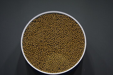 Pellets of dry food in containers. Food for pets.