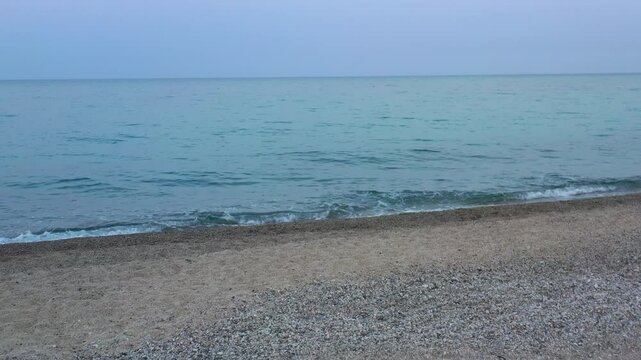 walking on the beach on a late summer day in Calabria, Soverato