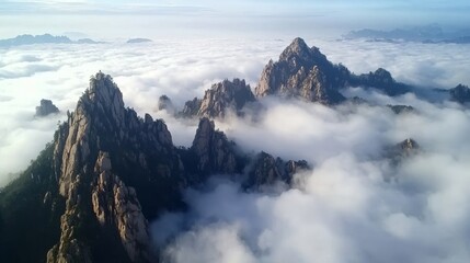 Aerial view, flying through the sea of clouds, Huangshan Mountain can be vaguely seen under the sea of clouds, sunshine 