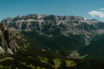 Obraz premium Dolomites mountain range with green valleys.