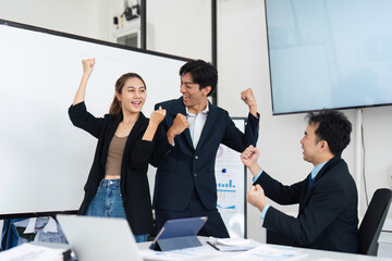 Victorious Teamwork and Enthusiasm. Colleagues celebrating their success and demonstrating team spirit.