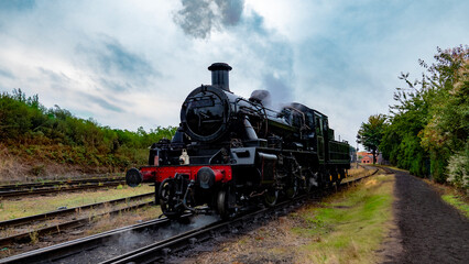 Steam Train Against a Countryside Backdrop