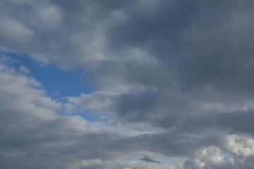 A piece of blue sky peeks out from behind the clouds