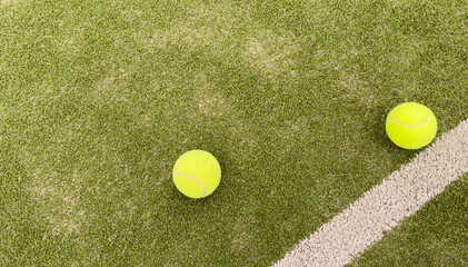 tennis balls on tennis grass court