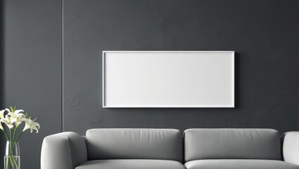 blank white mockup wall art hangs on dark wall in modern living room with gray sofa and vase of white flowers, creating minimalist and elegant atmosphere