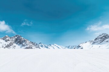 Snow-covered landscape with majestic peaks under bright blue sky
