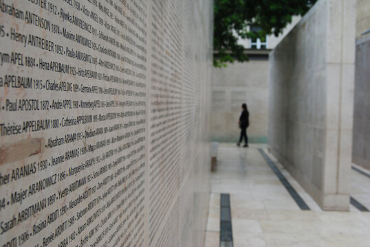 Paris, France &ndash; July 1, 2014. Wall of Names (Mur des Noms) at the Memorial de la Shoah in Paris is inscribed with the names of 76,000 Jews deported from France to Nazi extermination camps