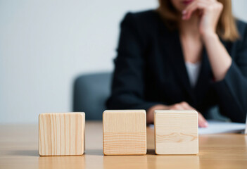 There are three wooden cubes lined up.
Wooden Blocks and Business Decision-Making.