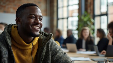 Smiling man in cozy sweater enjoying a collaborative workspace