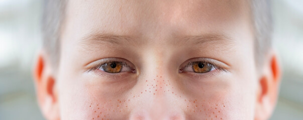 close-up part child's face, boy 10 years old Asian-European appearance, human eye looking seriously...