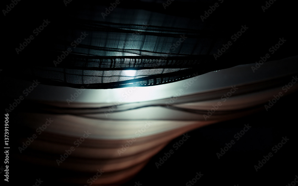 Poster abstract image featuring dark, flowing shapes with light piercing through. contrasting shadows and h