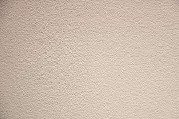 Obraz premium Close-up of a uniform textured pattern wall with a plaster surface.