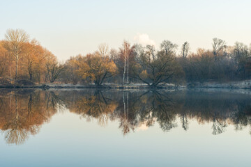 lake in the morning. A riverbank covered in frost