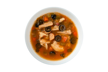 Solyanka soup served on a white plate against a white background, top view