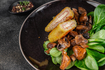 Cordon Bleu Cutlet meat chicken, ham, cheese appetizer dish fresh delicious gourmet food background on the table rustic food top view copy space