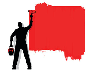 man paints roller wall