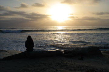 silhouette of a woman on the beach
