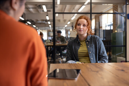 Young employee in a meeting with her manager