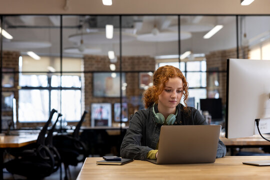 Young Woman Engaged While Working on Computer