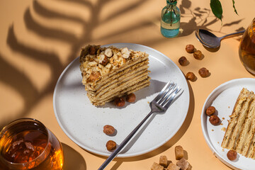 A piece of cake on a plate. Honey cake