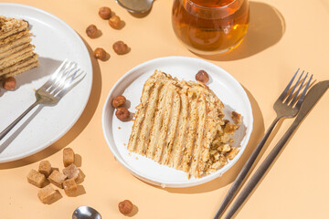 A piece of cake on a plate. Honey cake