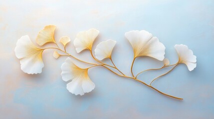 Delicate Ginkgo Leaves on Soft Blue Background with Golden Highlights for Nature Inspired Designs and Decoration Ideas