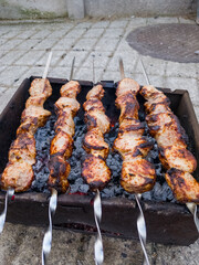A bunch of skewers that are sitting on a grill