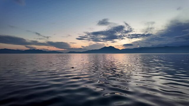 Sunset at Lake Koycegiz panorama, with calm waters reflecting the landscape, Mugla, Turkey.