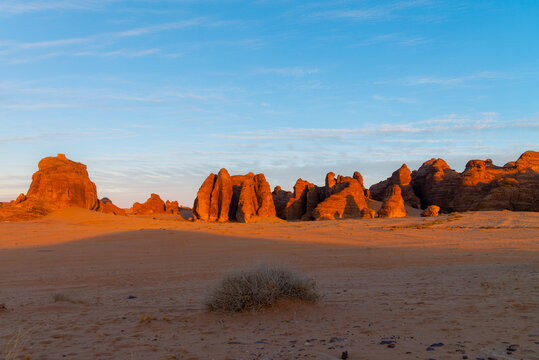 Dramatic sunset-to-sunrise timelapse in the rocky desert landscape of Saudi Arabia, showcasing unique sandstone formations, shifting light, and vibrant sky transitions.
