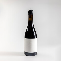 Mockup of classic bottle of red wine garnacha, on white background with copyspace, 750 ml, real photo