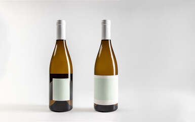 Mockup of white wine bottle chardonnay, front and back, on white background with copyspace, 750 ml, real photo