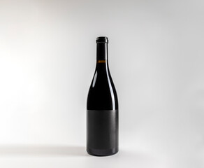 Mockup of classic bottle of red wine garnacha, on white background with copyspace, 750 ml, real photo