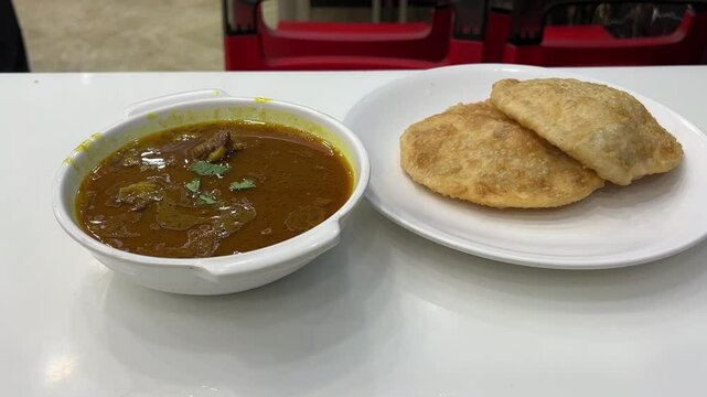 Dal puri served with mutton nihari at a road side joint in Kolkata.