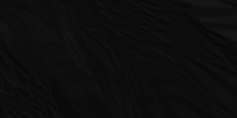 Dark black crinkle craft crushed old paper rough crumpled vintage empty cardboard sheet texture background.	