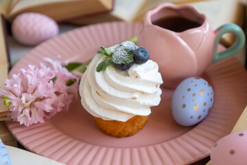 Easter 2025 table decoration for the holiday with flowers and accessories.