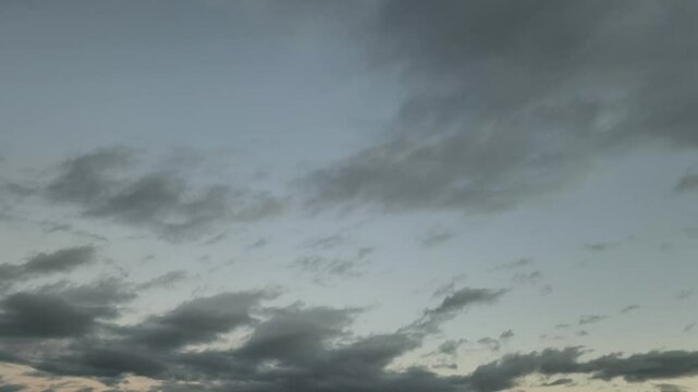 Sky with clouds changes color at dus
