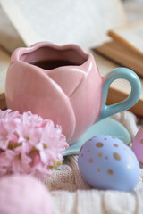 Easter 2025 table decoration for the holiday with flowers and accessories.