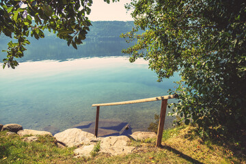 Mountain lake view in autumn. Millstatt am See. Descent to the water on Lake Millstatt in...