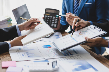 The business consulting meeting is analyzing the financial situation and planning cost reduction to...