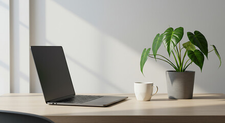 Fototapeta premium Modern workspace with laptop, plant, and coffee cup in bright room 