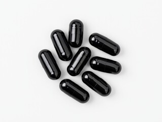 Fototapeta premium Isolated black capsules aligned on white surface in moody lighting minimalist healthcare layout illustrating strength detox pharmaceutical power and clarity in capsule presentation