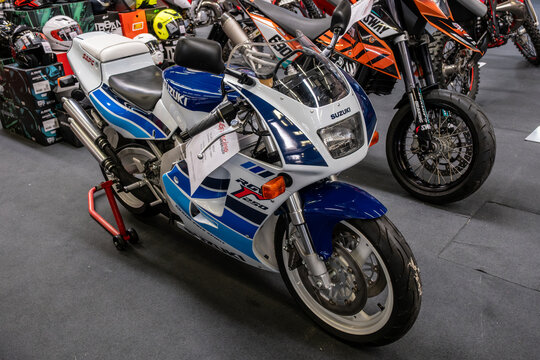 Modea, Italy : 2025 03 30 Motor Fest Expo Motorbike Two Suzuki two-stroke motorcycles, including an RG250 Gamma and an RGV250, are showcased indoors, highlighting their racing heritage.
