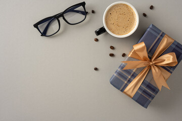 A cozy scene featuring a cup of coffee next to eyeglasses and a wrapped gift box