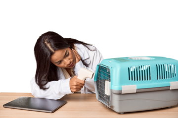 Young Filipino vet with laptop and carrier, caring